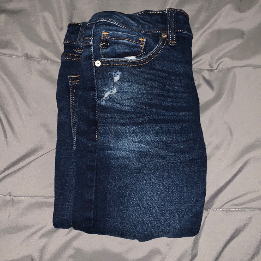 dark-wash ripped jeans